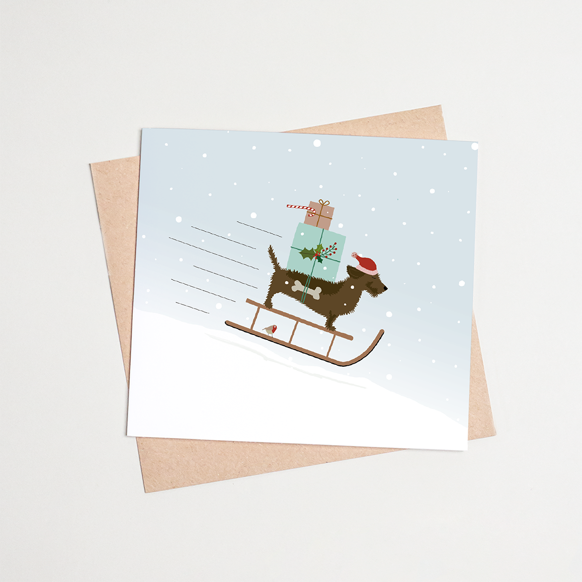 Kerstkaart-teckel-slee-sneeuw