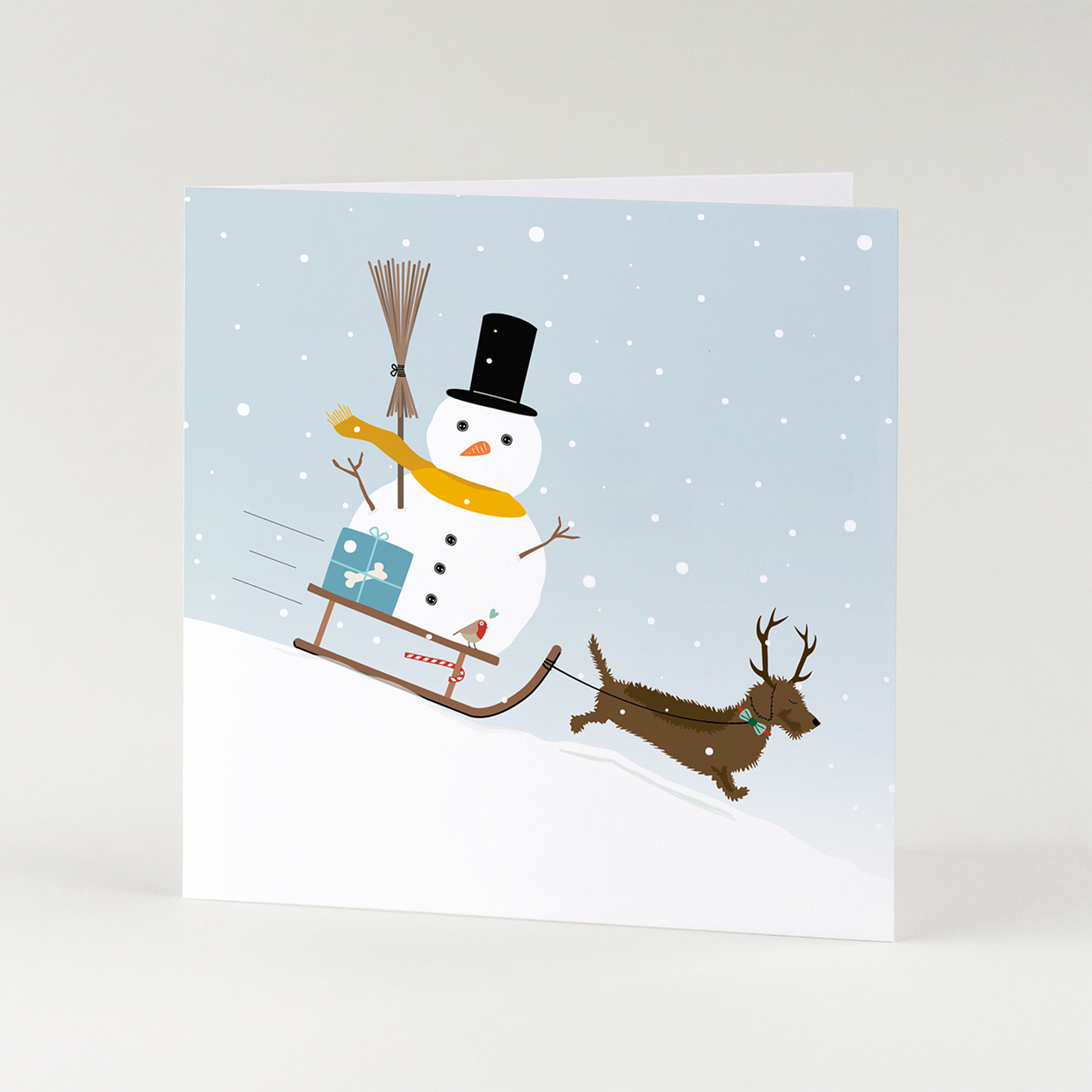 Kerstkaart-teckel-sneeuwpop-slee