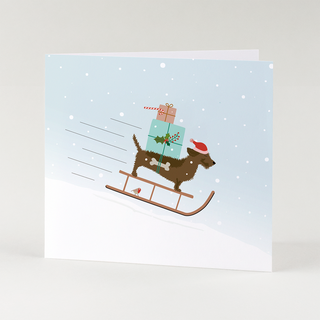 Kerstkaart-teckel-slee-sneeuw-sneeuwvlokken