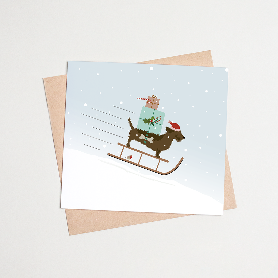 Kerstkaart-teckel-slee-sneeuw
