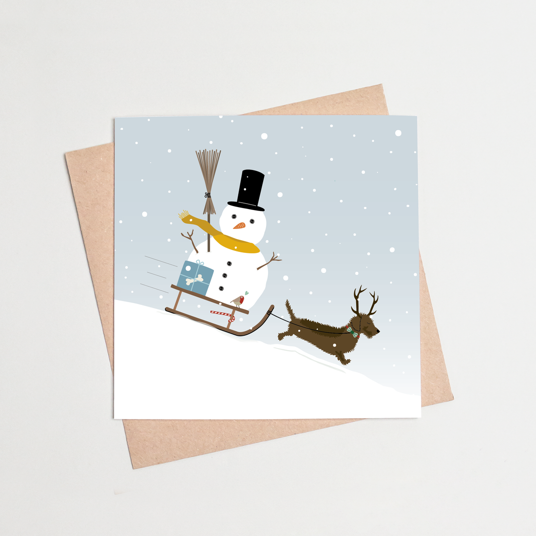Kerstkaart-teckel-sneeuwpop