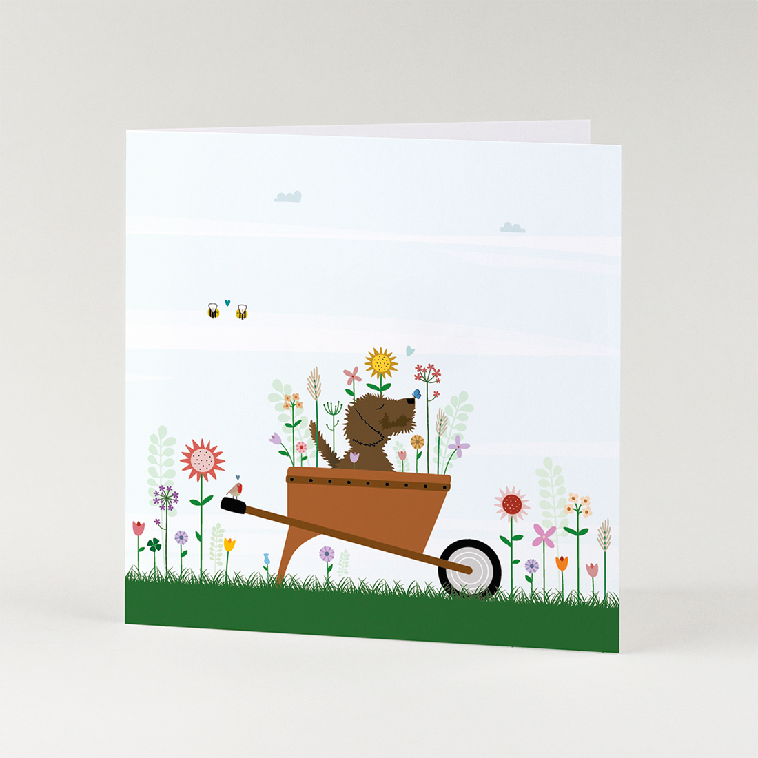 Bedankt kaart met teckel in kruiwagen vol bloemen – lieve geïllustreerde teckel wenskaart voor bedanken of zomaar.