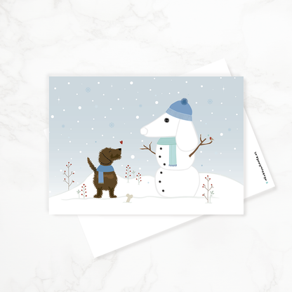 Winterkaart met teckel - voor- en achterzijde van de liggende ansichtkaart